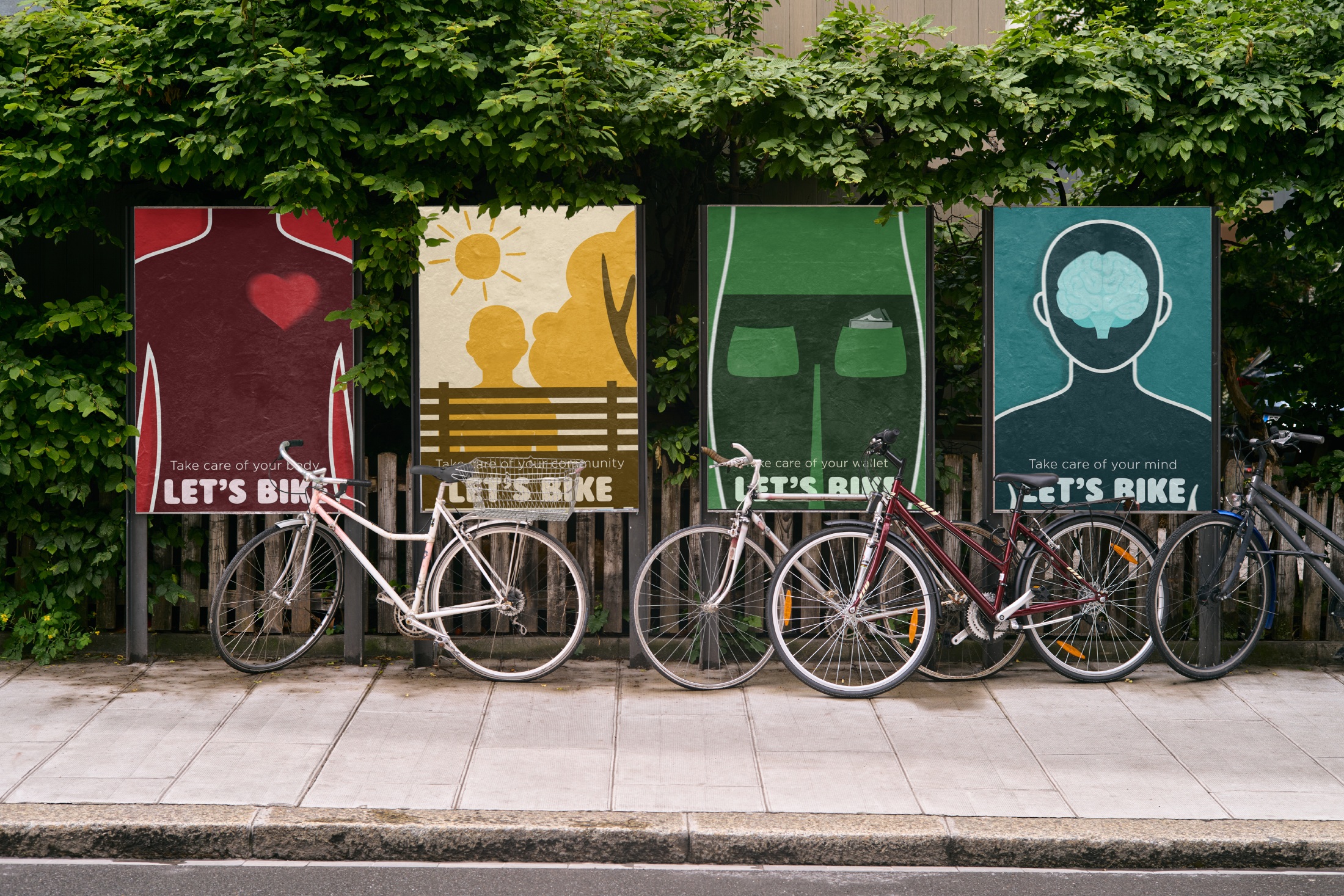 Four illustrated Let’s Bike posters installed beneath leafy trees beside parked bicycles.